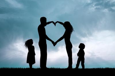family making a heart with their arms