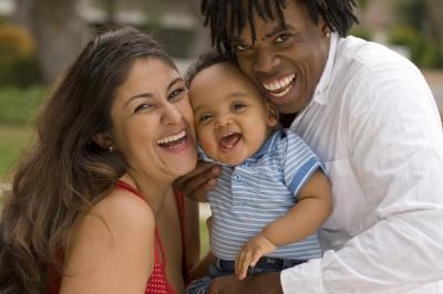 Picture of multi-ethnic family - mom, dad, baby.