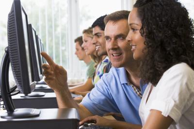 group of individuals looking at computer screens
