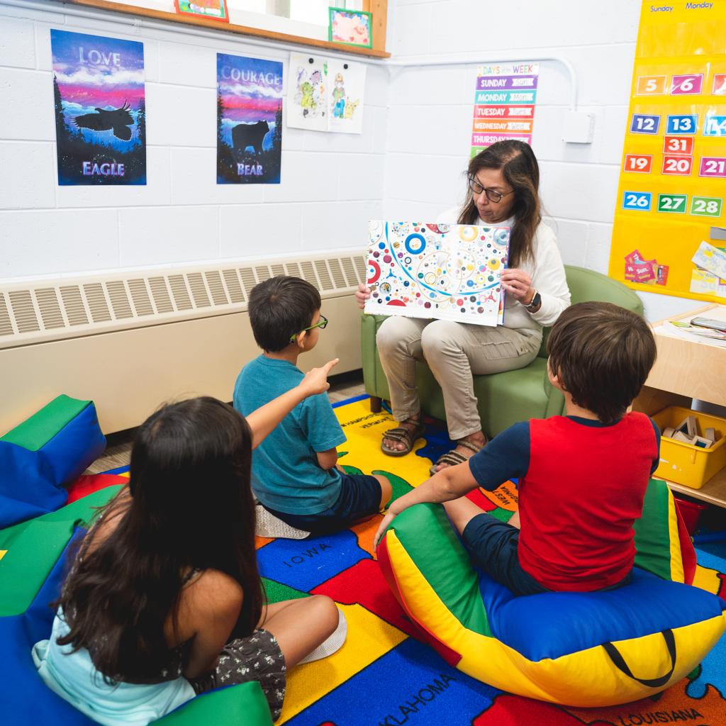 child care teacher reads to children