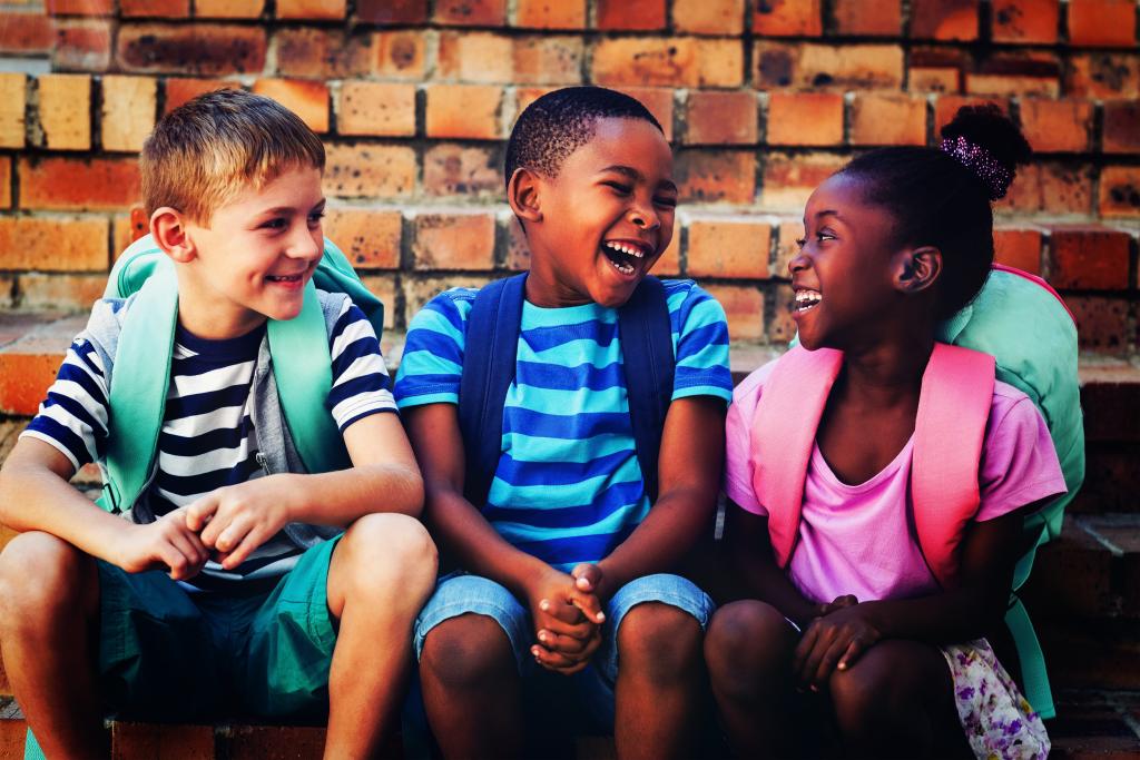 group of teens smiling and laughing